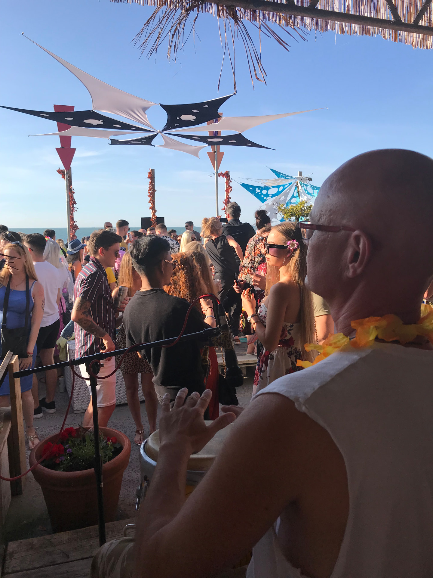 Rooftop crowd by the sea